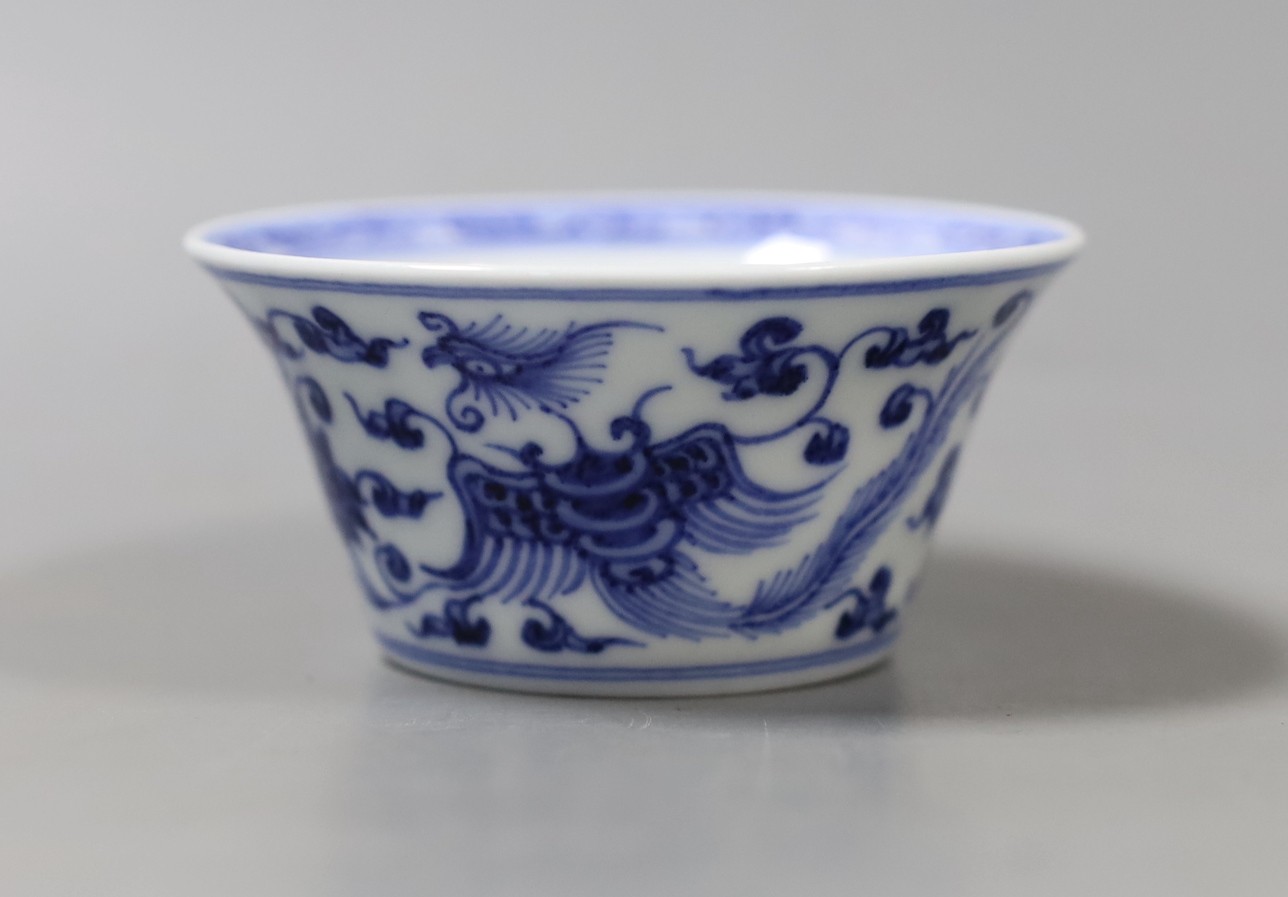 A Chinese blue and white bowl with floral motif, inscription to base - 4cm tall